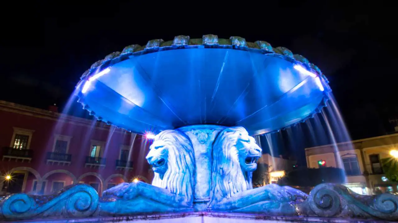 Article Header Photo of a Large Water Fountain with Blue Lights and Lion Heads