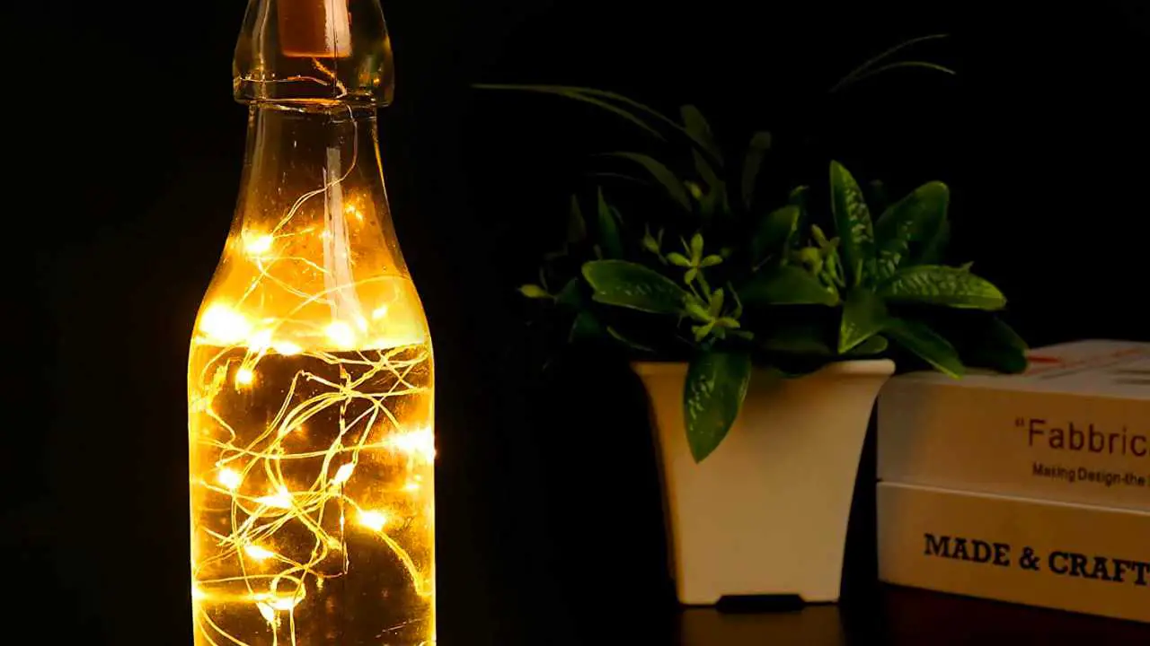 Photo of a home made bottle filled with LED lights powered by solar energy